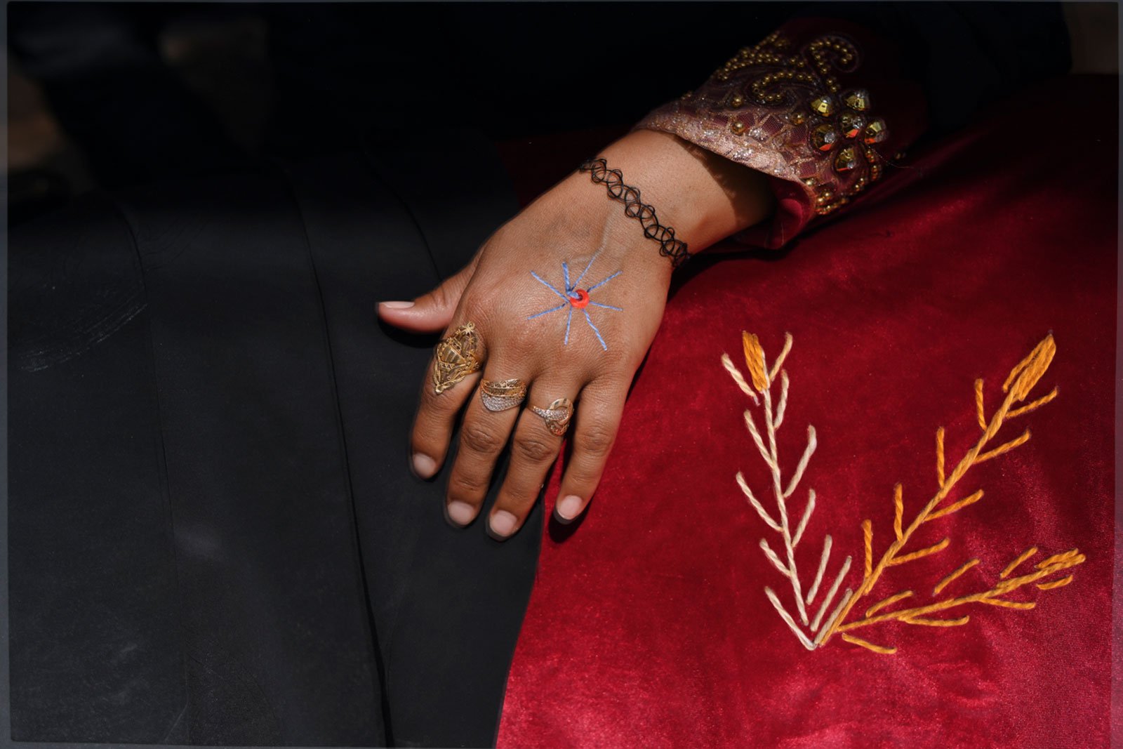 woman's hand and traditional dress