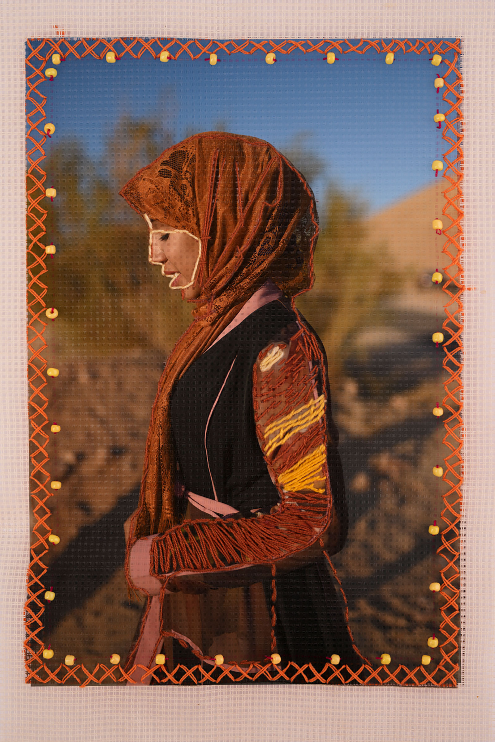 Partial embroidery photo of woman in hijab 