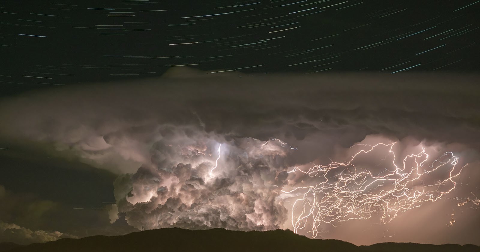 Epic Lightning Storm and Swirling Star Trails Caught in One Incredible Photo