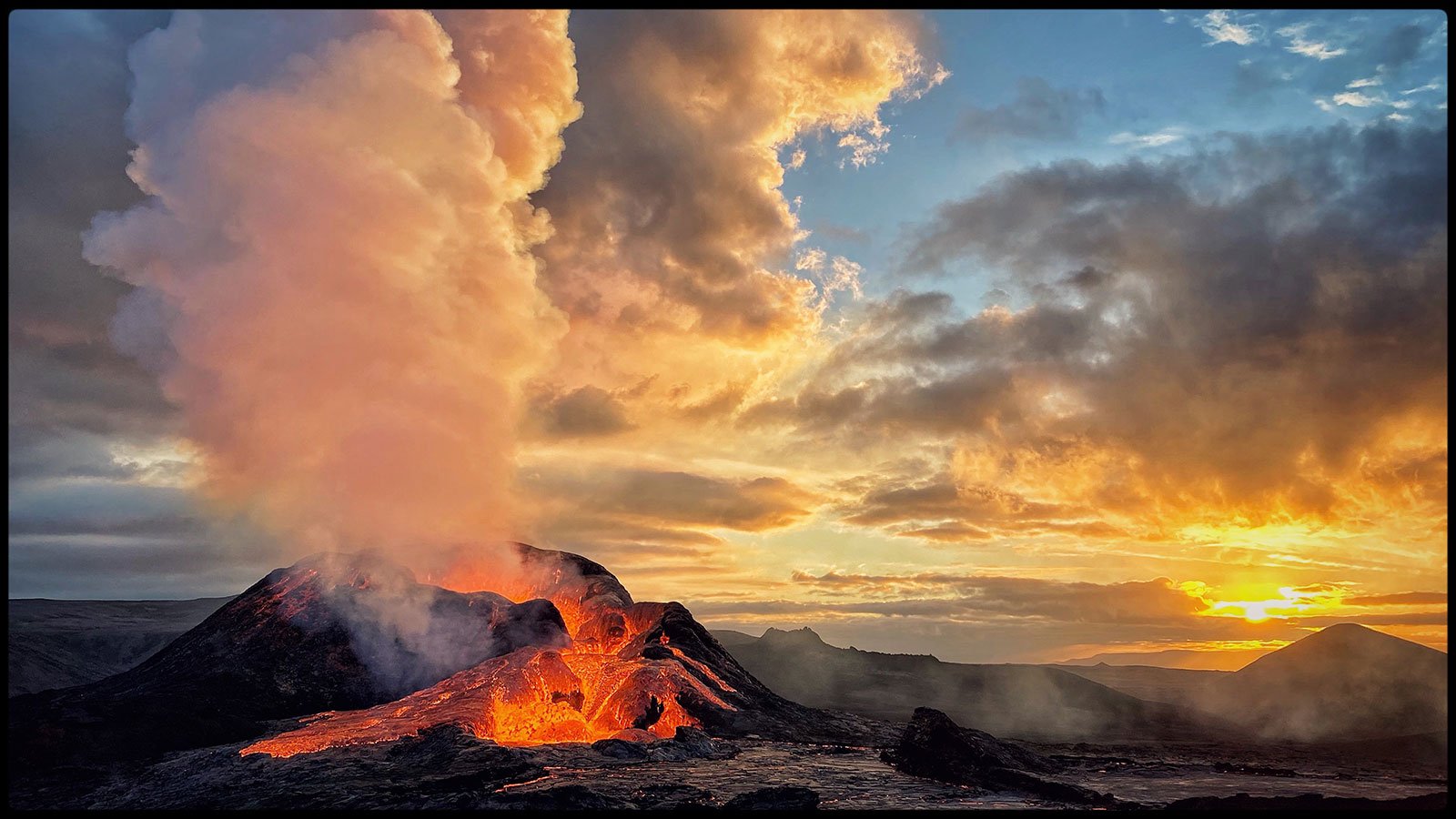 A volcano erupting with a bright orange sunrise in the distance