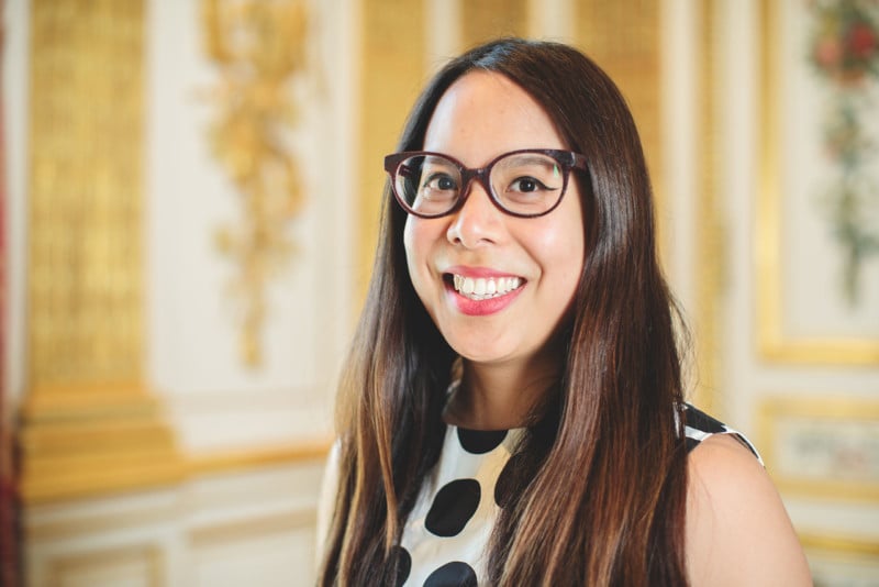 Natalie Cheung , with long dark brown hair and glasses and polka-dot shirt