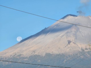 Photographer Couple Captures Photo of 'UFO' Above Erupting Volcano