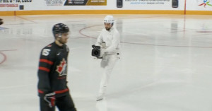 Camouflaged cameraman hockey