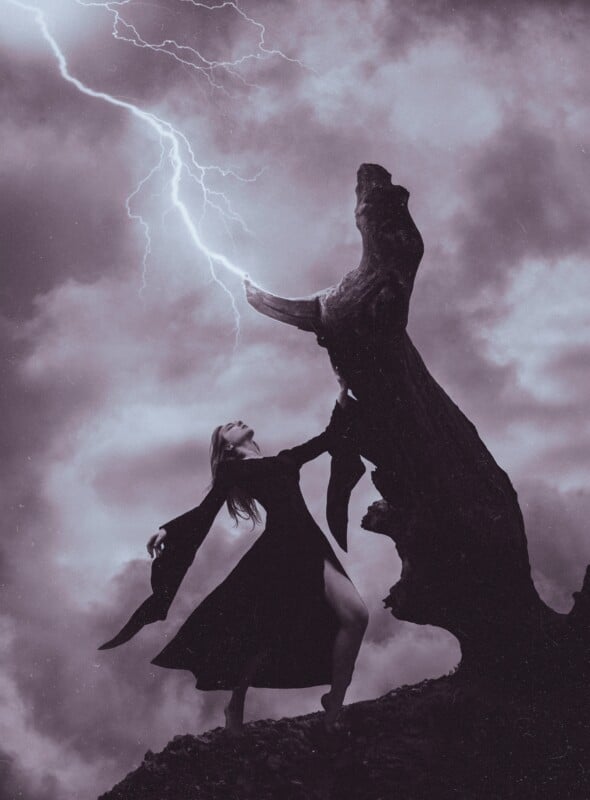 woman with black hair and a black dress looking up at a thunder bolt 