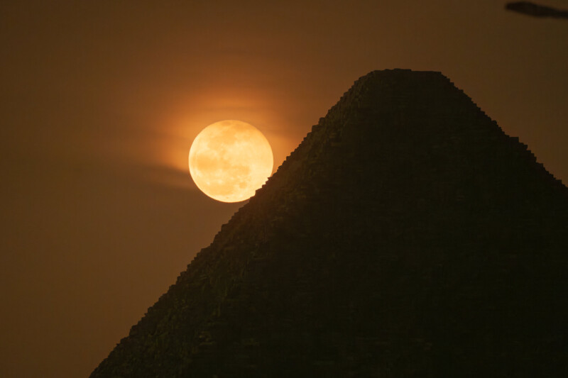 Full Moon rising behind the Great Pyramid of Giza. 
