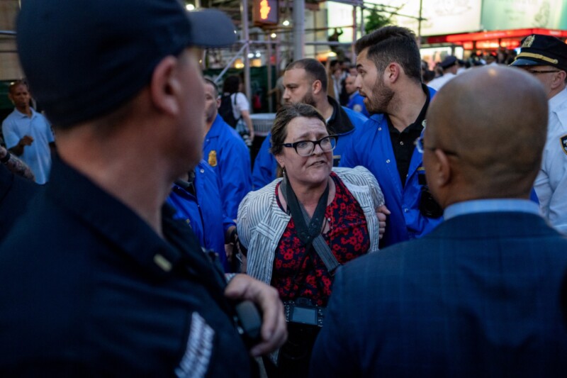 Stephanie Keith is led away in handcuffs by the NYPD