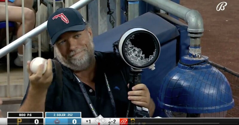Baseball hits camera lens