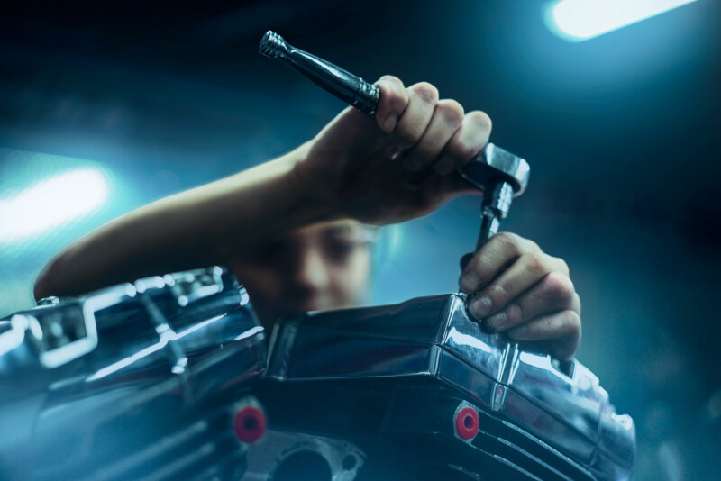 A motorcycle mechanic photographed for a lifestyle photoshoot by Blair Bunting. The portraits were photographed on location at universities and shops across the US over a period of a month.