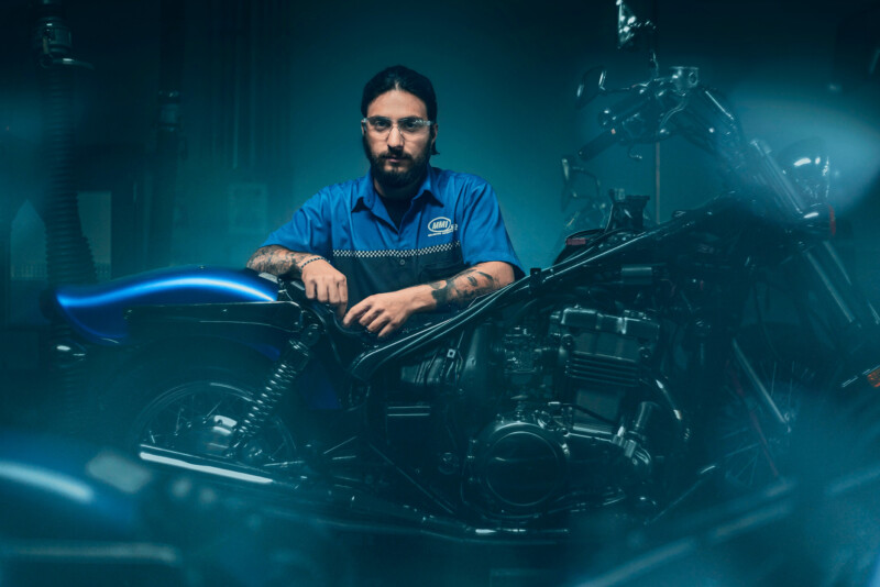 A motorcycle mechanic photographed for a lifestyle photoshoot by Blair Bunting. The portraits were photographed on location at universities and shops across the US over a period of a month.