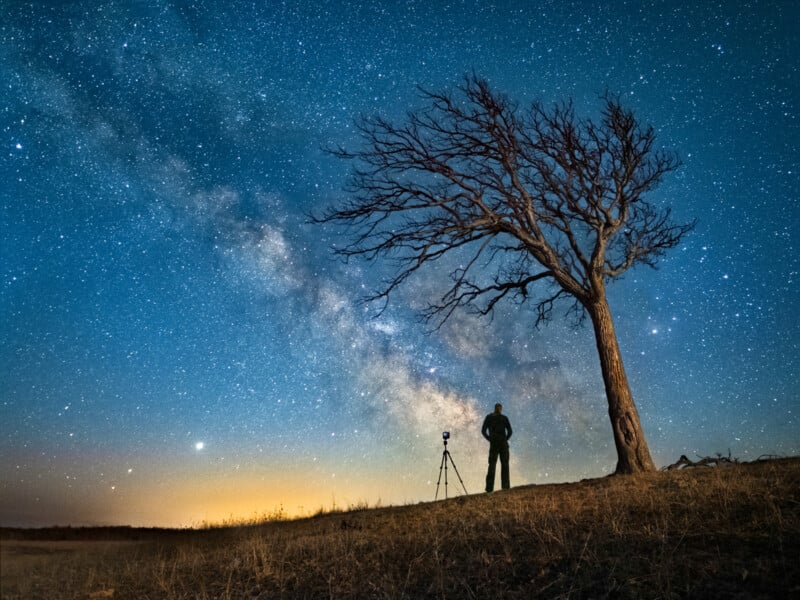 Skywatcher Beams at the Starry Night Sky in Stunning Cosmic Selfie