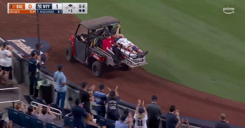 Pete Stendel is carted out of the Yankees Stadium after being strcuk in the face by a baseball 