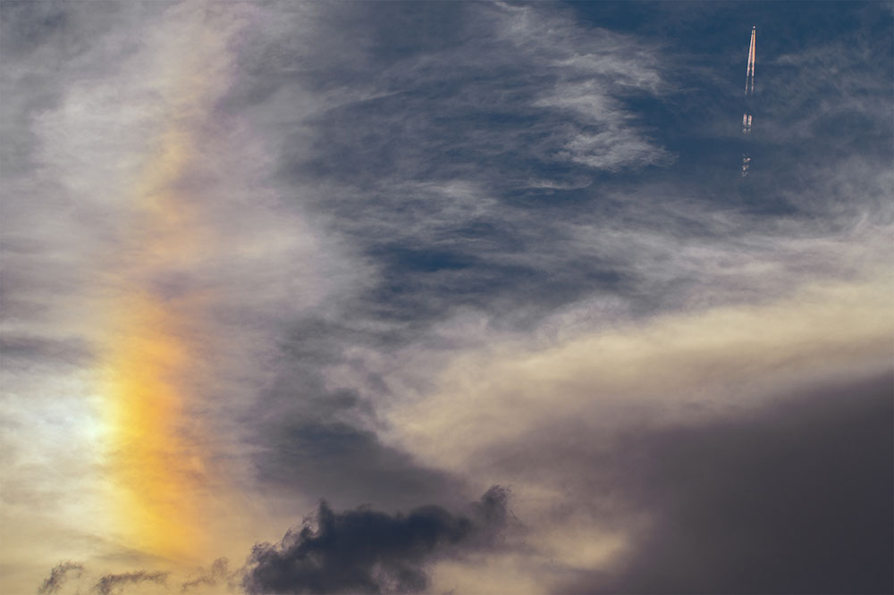 Photographer Captures Rare Rainbow Contrails Pumping Out of an Airplane