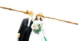 Fraying rope above bride and groom