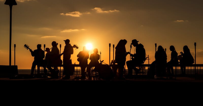 AI image of a crowd of people playing music at sunset
