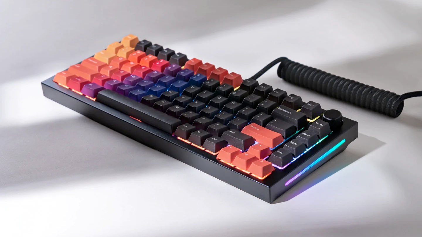 A photo of a fully assembled GMMK Pro keyboard rests on a surface.