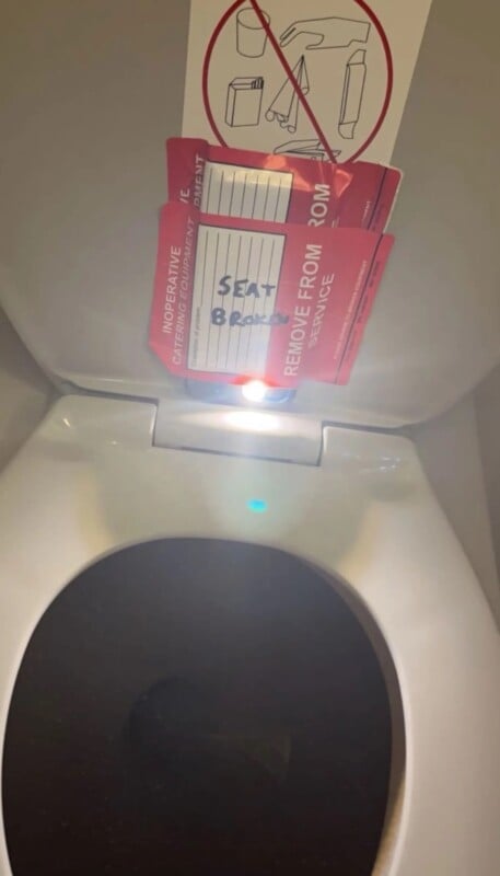 Camera taped to a toilet seat on American Airlines