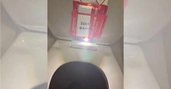 Camera taped to a toilet seat on American Airlines