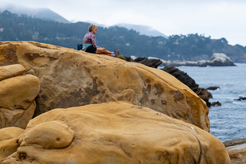 Nikkor Z 135mm f/1.8 Plena S woman on the rocks