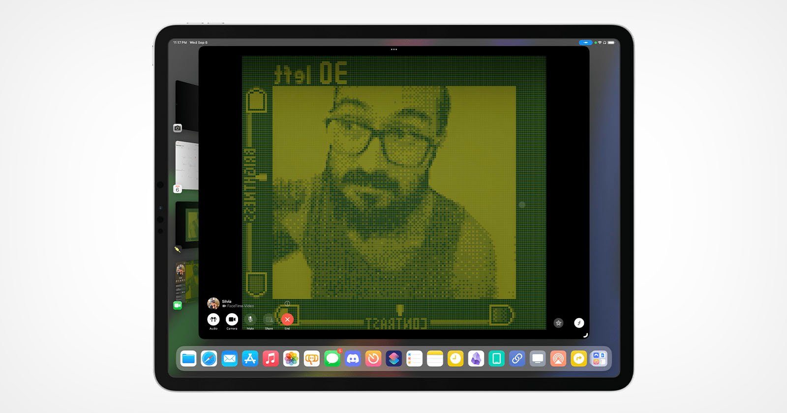 An image from the Game Boy camera appears on an iPad Pro