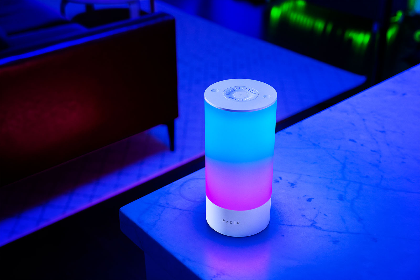 Razer's Aether Lamp Pro lit with blue lights at the top and purple on the bottom half.