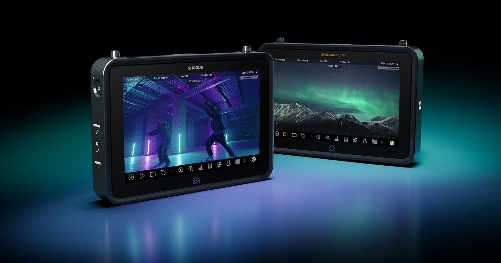 The new Atomos Shogun and Shogun ultra camera-mountable recorder are seen together against a black background as the screens light up the forefront.