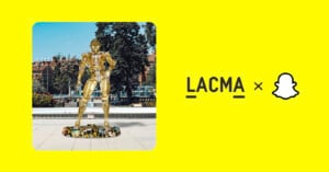 An AR monument is seen next to the logos for the museum LACMA and Snapchat, all on a bright yellow background.