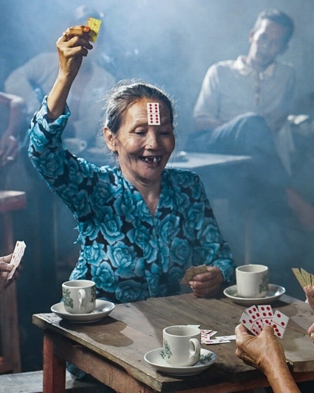 A different photo of the woman playing cards