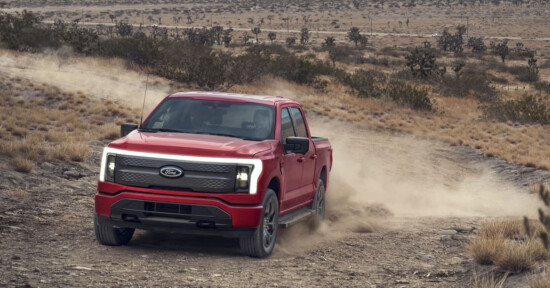 Ford patent for a photography assistant, Ford F-150 Lightning in red shown tearing up some dirt.