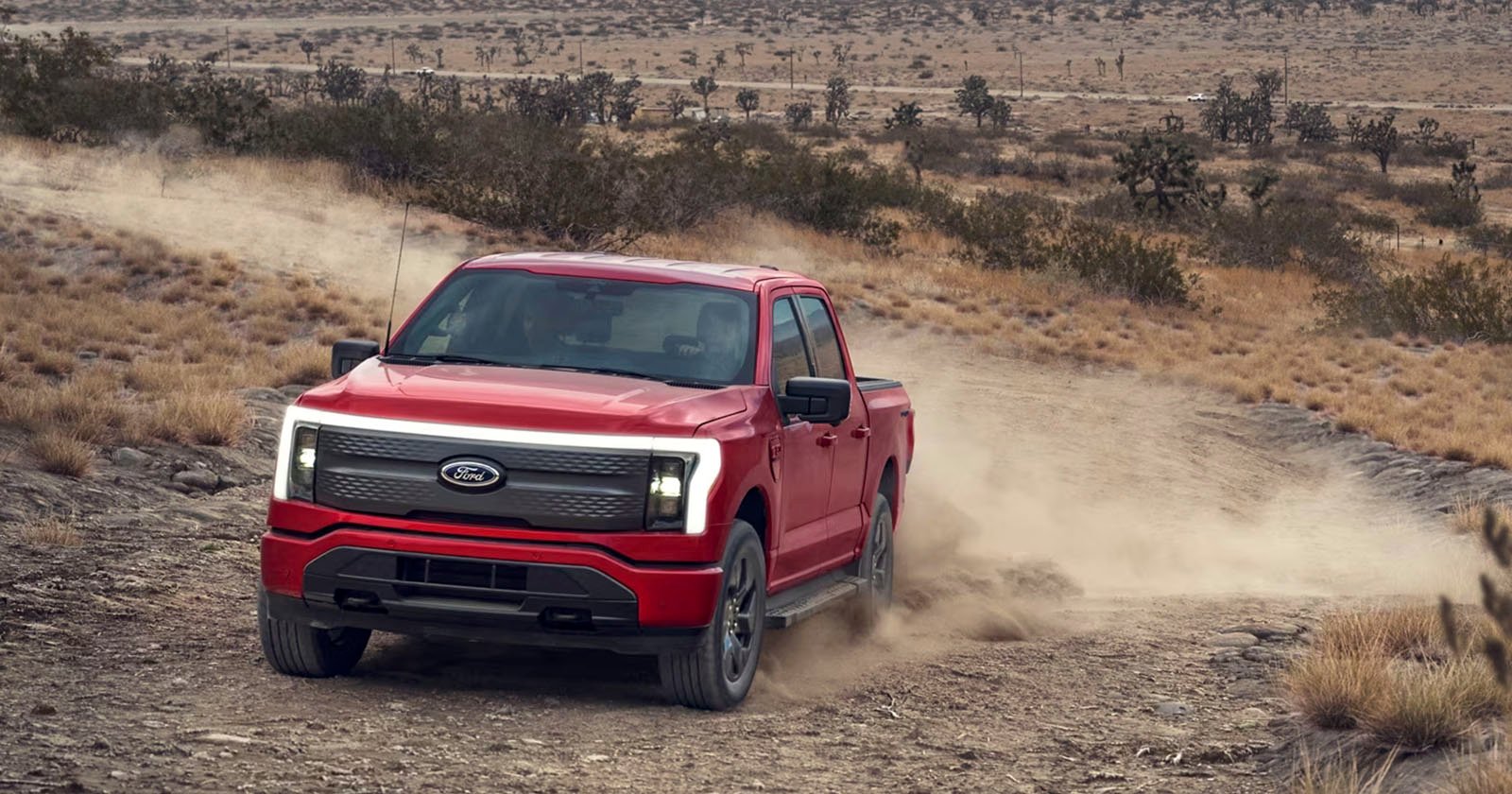 Ford patent for a photography assistant, Ford F-150 Lightning in red shown tearing up some dirt.