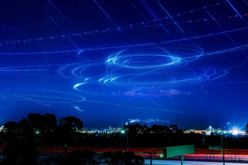 Long exposure photos stacked into one image showing surveillance aircraft above the APEC summit in San Francisco