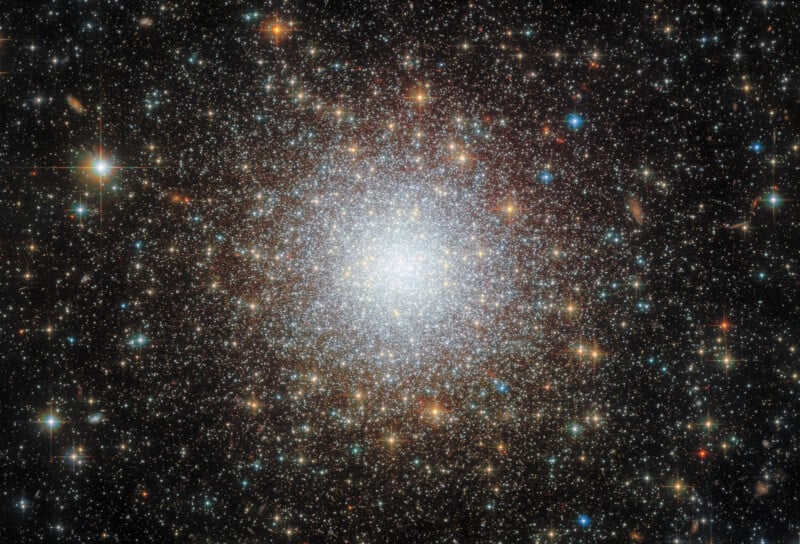 Hubble Reveals Intricate, Beautiful 11.6 Billion-Year-Old Cluster of