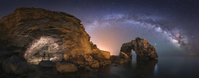 Es Pontàs arch in Mallorca, Spain under the arc of the Milky Way.