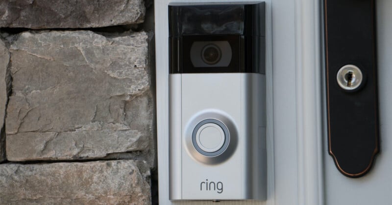 A Ring doorbell and camera on the front of a building.