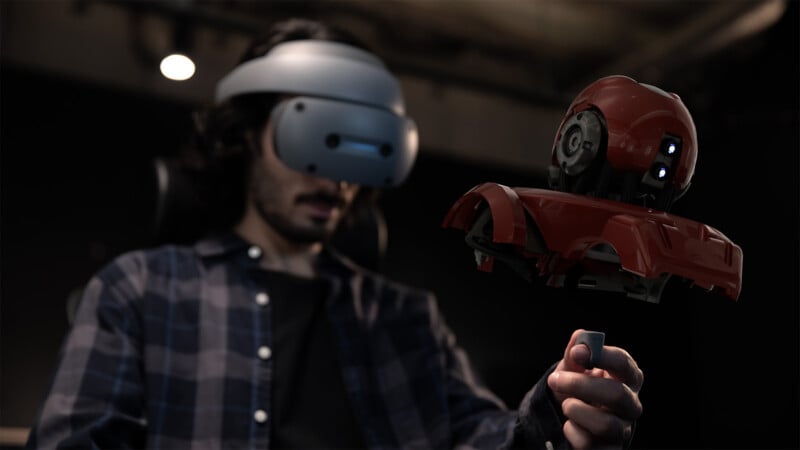 A man uses the ring controller with the Sony XR HMD headset to manipulate a virtual 3D design. 