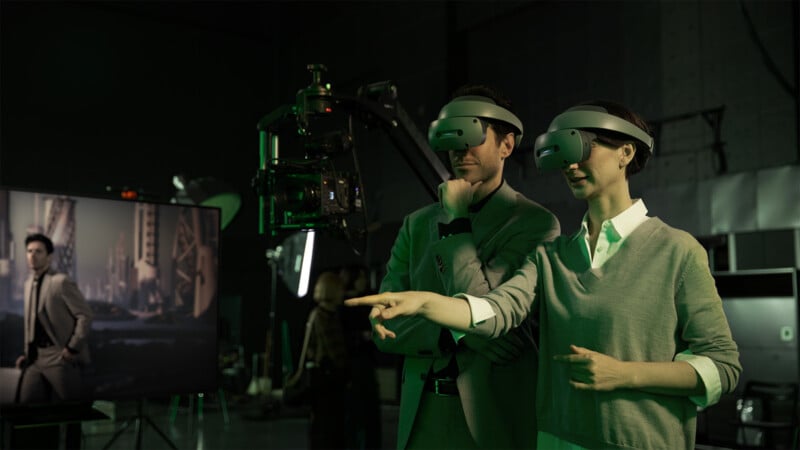 A man and women stand in a muvie studio while wearing the Sony XR HMD headsets.