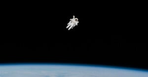 Astronaut Bruce McCandless II approaches his maximum distance from the Earth-orbiting Space Shuttle Challenger in this 70mm photo from Feb. 7, 198
