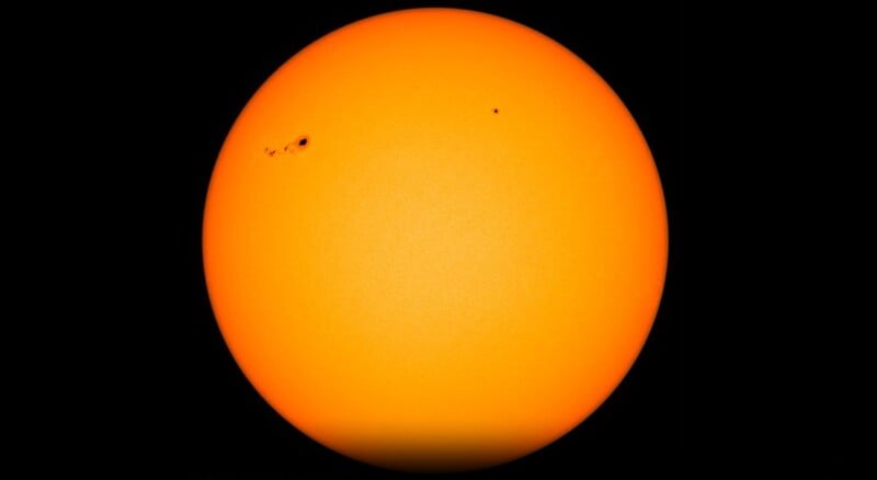 An image of the Sun shows prominent sunspots. 