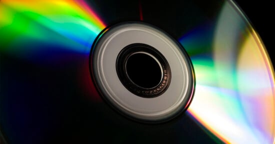 Close-up photo of a compact disc against a black background