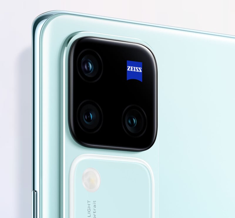 A close-up photo of the back of the Vivo V30 Pro smartphone, showing its Zeiss-branded triple camera array. 