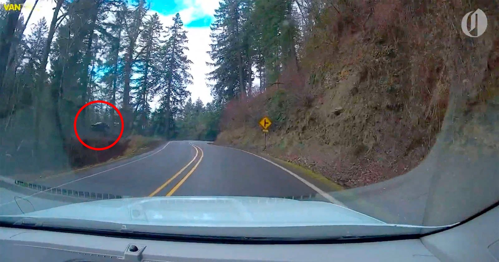 Dashcam footage shows a car go off the road before heading toward an embankment.