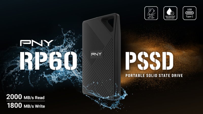 The PNY RP60 portable SSD is placed against a black background with water and dust splashing on it and text surrounding it. 