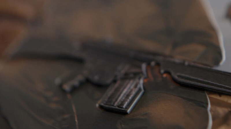 Raised textured shows the grooves of a rifle.