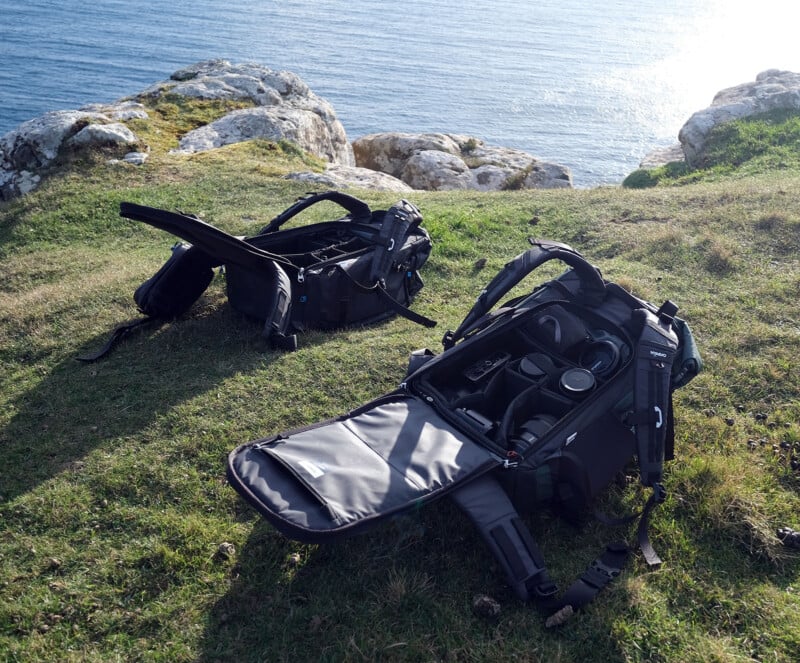 Two Fjord 50-C backpacks on the grass.