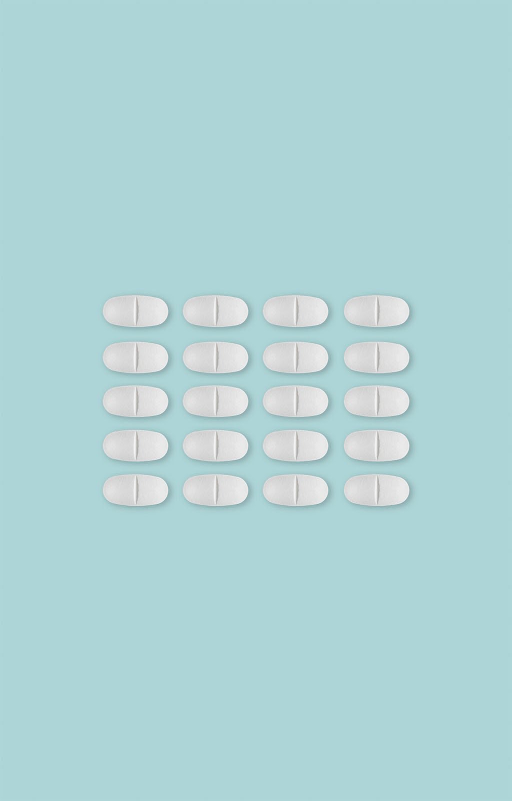 Four columns of white oval tablets, with each column containing five tablets, arranged on a uniform light blue background.