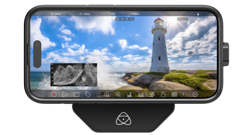 A smartphone screen displaying a video editing app interface with an image of a lighthouse on a rocky shoreline, waves crashing against the rocks under a blue sky with clouds.