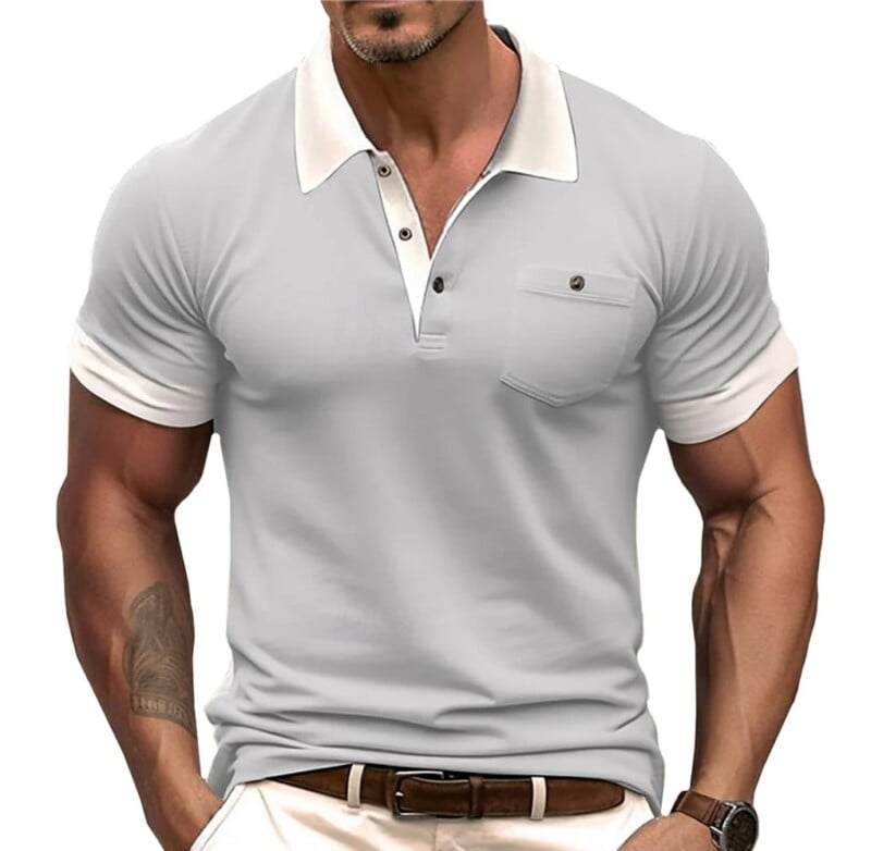 A muscular man wearing a fitted light gray polo shirt with a collar and a buttoned pocket, paired with a dark belt. Only his torso is visible in the image.