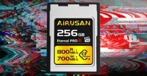 A 256gb "airusan" compact flash memory card with specs labeled 800 mb/s read and 700 mb/s write speed, centered over a colorful, swirling digital art background.