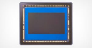 An image sensor with a large, square-shaped central area surrounded by intricate circuits on a clean, white background.