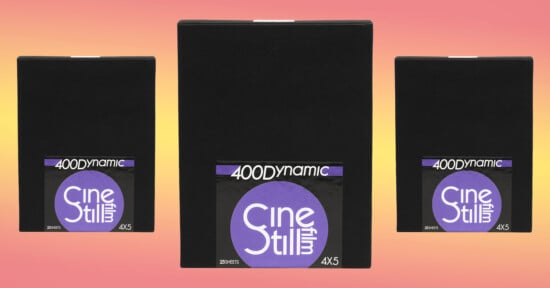Three boxes of CineStill 400D 4x5 film are placed against a yellow to pink gradient.
