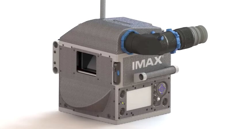 3d model of an imax projector with a prominent lens on the left side, textured casing, and various control buttons and ports.